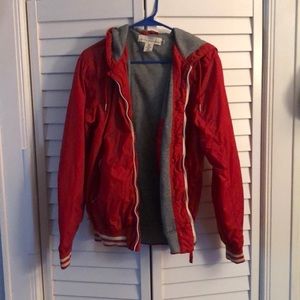 Red Jacket With white lines around the wrist.